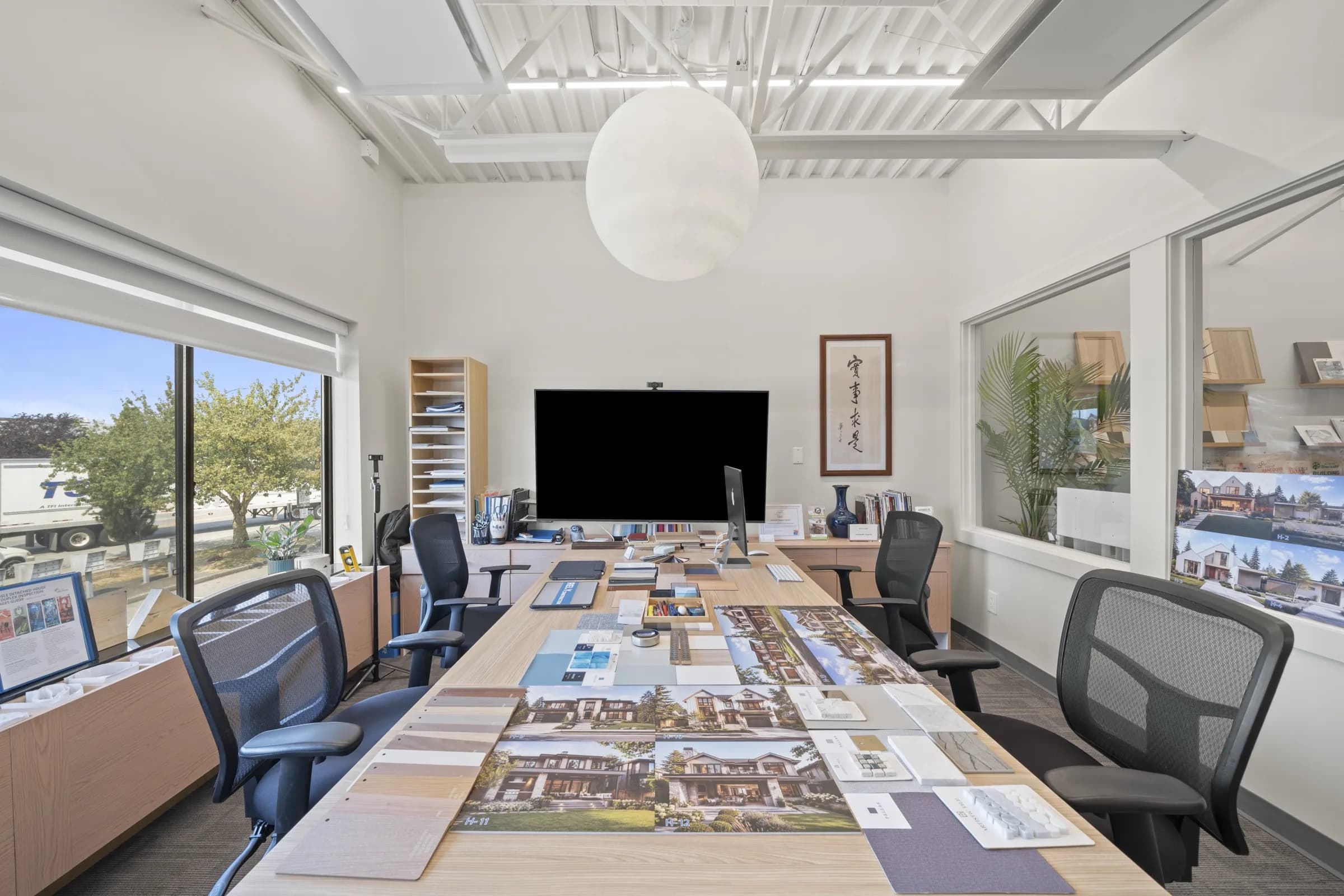 Meeting room with project boards laid out on the table